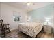 Bedroom with window, fan, hard flooring, and white walls at 26535 Deuce Ct, Leesburg, FL 34748