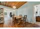 Dining room and living room featuring hardwood floors and light blue walls at 26535 Deuce Ct, Leesburg, FL 34748