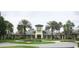 A luxurious community clubhouse features manicured landscaping and an inviting entrance at 27024 Old English Ct, Leesburg, FL 34748