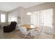Cozy dining area features a round table, sliding glass doors and lots of natural light at 27024 Old English Ct, Leesburg, FL 34748