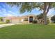 Well-maintained home with a lush green lawn, mature trees, and attractive landscaping at 27024 Old English Ct, Leesburg, FL 34748