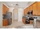 Bright kitchen with stainless steel appliances, granite counters, and lots of storage at 27024 Old English Ct, Leesburg, FL 34748