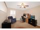 Functional home office space features a desk, ample storage, and a comfortable chair at 27024 Old English Ct, Leesburg, FL 34748