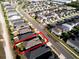 Aerial of a home and its neighborhood, emphasizing the property's location and surrounding landscape at 2749 Hilltop Rd, Clermont, FL 34711