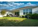 Spacious backyard with a covered patio, perfect for outdoor dining and relaxation at 2749 Hilltop Rd, Clermont, FL 34711