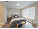 Serene bedroom featuring a wooden bed, modern decor, a bright window, and comfortable bedding at 2749 Hilltop Rd, Clermont, FL 34711
