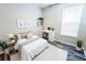 Stylish bedroom with a workstation, features hardwood floors and a window, offering a modern, functional space at 2749 Hilltop Rd, Clermont, FL 34711