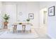 Minimalist dining area with natural lighting, stylish furniture, and open layout at 2749 Hilltop Rd, Clermont, FL 34711