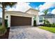 Paved driveway leading to a two-car garage, offering convenience and additional parking space at 2749 Hilltop Rd, Clermont, FL 34711