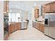Spacious kitchen featuring stainless steel appliances, granite countertops, and ample cabinet space at 2749 Hilltop Rd, Clermont, FL 34711
