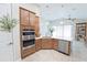 Stylish kitchen featuring stainless steel appliances, a kitchen island, and pendant lighting at 2749 Hilltop Rd, Clermont, FL 34711