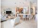 Open-concept living room with a modern kitchen, island with seating, and cozy living area at 2749 Hilltop Rd, Clermont, FL 34711