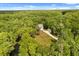 Aerial view of home nestled within lush greenery, featuring river access, offering unparalleled privacy at 2870 Belinda Dr, Deland, FL 32720