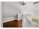 Attic featuring hardwood floors, neutral walls and view from the stairwell at 2870 Belinda Dr, Deland, FL 32720