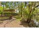 Charming backyard featuring a lovely home with a screened-in porch and river access for relaxation at 2870 Belinda Dr, Deland, FL 32720