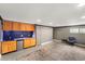 Basement showcasing wet bar, hardwood cabinets, and concrete flooring throughout at 2870 Belinda Dr, Deland, FL 32720