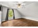 Bedroom with hardwood floors, ceiling fan, and window offering an outside view at 2870 Belinda Dr, Deland, FL 32720