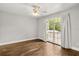 Bright bedroom boasts hardwood floors and a large window with picturesque views at 2870 Belinda Dr, Deland, FL 32720