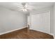 Bright bedroom with hardwood floors, double closet, and view to the entryway at 2870 Belinda Dr, Deland, FL 32720