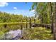 Beautiful view of a dock and river perfect for enjoying nature and outdoor activities by the waterfront property at 2870 Belinda Dr, Deland, FL 32720