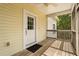 Inviting porch with wood floors, ceiling fan, and a white front door with glass panels at 2870 Belinda Dr, Deland, FL 32720
