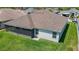 Aerial backyard view of home featuring lawn, siding, and screened-in porch at 2992 Hicks Pl, The Villages, FL 32163