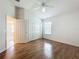 Bedroom with light hardwood floors, ceiling fan and closet at 2992 Hicks Pl, The Villages, FL 32163