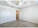 Bedroom featuring plush carpets, a ceiling fan, and closet at 2992 Hicks Pl, The Villages, FL 32163