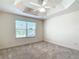 Bedroom featuring plush carpets, a ceiling fan and a window with backyard views at 2992 Hicks Pl, The Villages, FL 32163