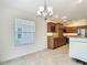Dining room showcasing a kitchen with stainless steel appliances and a wine rack at 2992 Hicks Pl, The Villages, FL 32163
