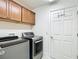 Laundry room with cabinetry and appliances at 2992 Hicks Pl, The Villages, FL 32163