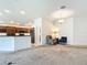 Open floor plan with living room flowing into the kitchen, featuring modern appliances and ample cabinet space at 2992 Hicks Pl, The Villages, FL 32163