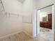 Walk-in closet with wire shelving and vinyl flooring at 2992 Hicks Pl, The Villages, FL 32163