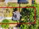 Aerial view of a property with mature trees and a clearly defined lot line, offering a sense of space and privacy at 301 Brookstone Ln, Fruitland Park, FL 34731