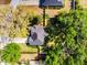 Aerial view of a property with mature trees and a well defined lot, offering privacy and beauty at 301 Brookstone Ln, Fruitland Park, FL 34731