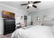 Cozy bedroom with grey carpet, ceiling fan and white trim at 301 Brookstone Ln, Fruitland Park, FL 34731