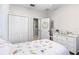 Bedroom featuring a decorative wreath, double closet and a bright, airy ambiance at 301 Brookstone Ln, Fruitland Park, FL 34731