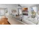 Spacious living room featuring fireplace with tv and large sectional sofa at 301 Brookstone Ln, Fruitland Park, FL 34731