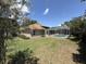 Spacious backyard featuring a screened pool at 3030 Brighton Rd, Eustis, FL 32726