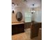 Bathroom featuring an elegant vanity, tile floors and an updated shower stall at 3030 Brighton Rd, Eustis, FL 32726