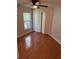 Bedroom featuring hardwood floors, a window and a closet at 3030 Brighton Rd, Eustis, FL 32726