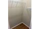 Walk-in closet featuring hardwood floors and wire shelving units at 3030 Brighton Rd, Eustis, FL 32726