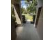 An eye-level shot of the entrance with stone-like pillars and landscaped foliage at 3030 Brighton Rd, Eustis, FL 32726