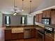Modern kitchen featuring granite countertops, stainless steel appliances, and ample cabinet space at 3030 Brighton Rd, Eustis, FL 32726