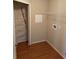 Laundry room with wire shelving and hardwood floor at 3030 Brighton Rd, Eustis, FL 32726