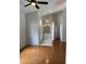 Bright and airy living room featuring hardwood floors, high ceilings, and a modern chandelier at 3030 Brighton Rd, Eustis, FL 32726