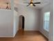 An interior view of a living room with hardwood floors and a light-colored wall at 3030 Brighton Rd, Eustis, FL 32726