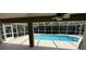 The covered pool area overlooks the backyard at 3030 Brighton Rd, Eustis, FL 32726