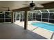 Screened-in lanai and covered patio with pool at 3030 Brighton Rd, Eustis, FL 32726