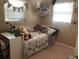 bedroom featuring a single bed, desk, and multiple toys and decorations at 312 North Blvd W, Davenport, FL 33837